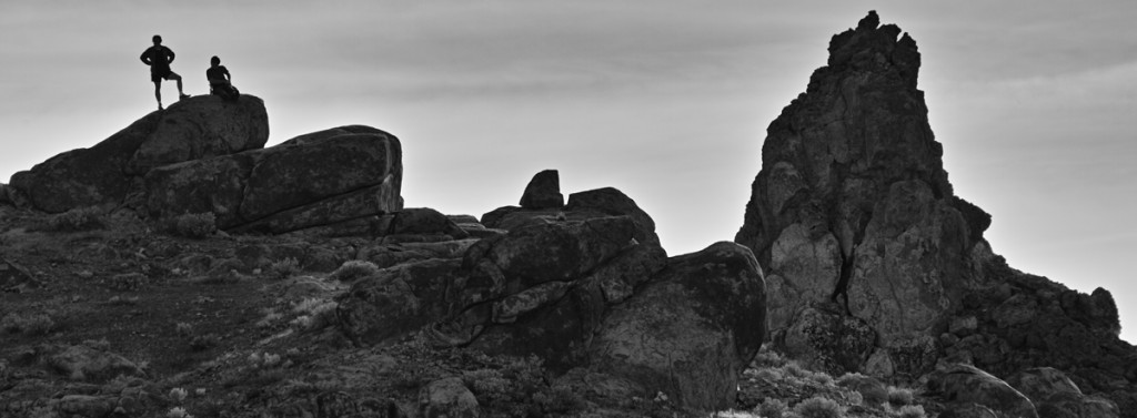 A couple stands on a rock and overlooks the desert. Designated as a National Natural Landmark in 1967, the Trona Pinnacles, consisting of more than 500 tufa spires, is situated 10 miles south of Trona, a small town in California. Camera: SD1 Lens: APO 50-500mm F4.5-6.3 DG OS HSM, Exposure mode: Manual, ISO: 200, White balance: daylight, Shutter speed: 1/1250 sec,Aperture: f8.0, Focal length: 413mm