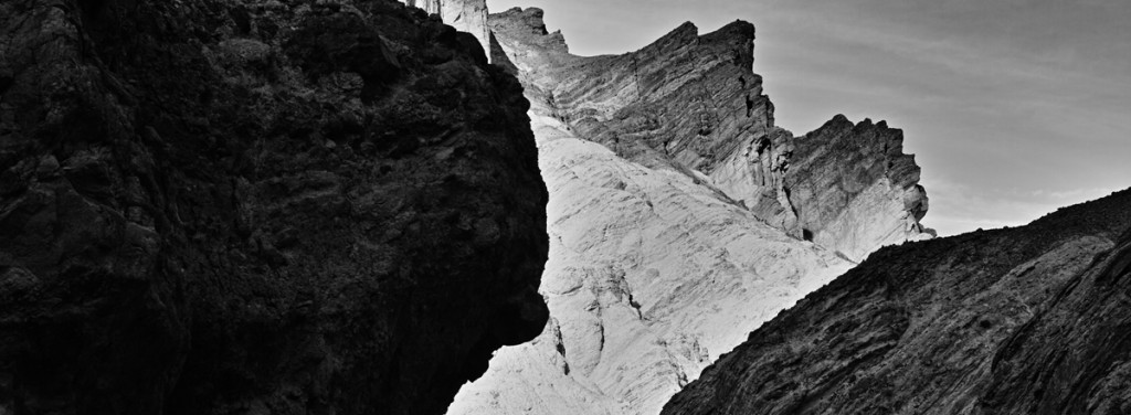 The setting sun creates a dramatic world of light and dark at Golden Canyon in Death Valley National Park. Fascinated by the layers of history in the rocks, I pressed the shutter using the large aperture standard lens.