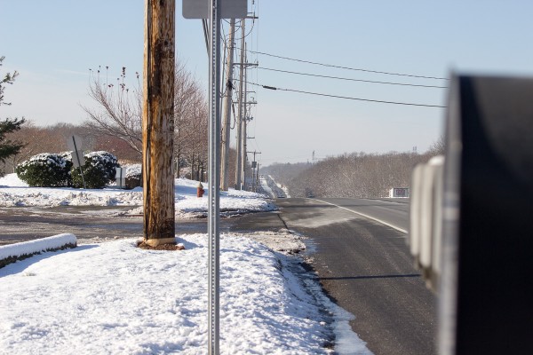 Here's the same lens at 70mm, as wide as it will go. The downhill section of the road feels much more distant. Again, we are focused at the horizon. Notice the slight blur on the mailboxes in the foreground.