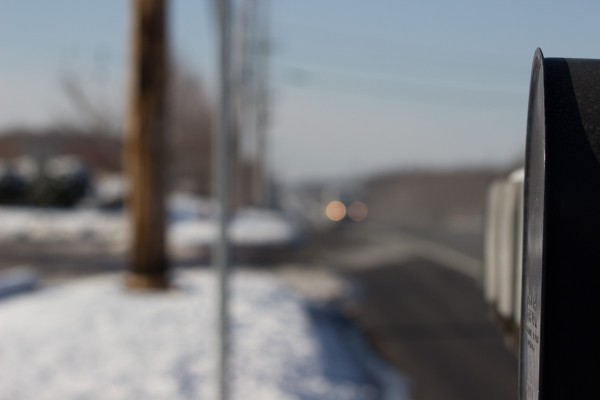 And now, we've refocused on those mailboxes. Every other camera setting is the same (1/640 F6.3 ISO 100). Notice how much more abstractly blurred the background is now. 