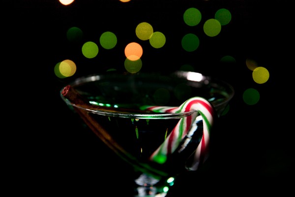 Mint Martini seen through the Sigma 24-105mm F4 DG OS HSM | A on a classic 5D. 1/15 F5.6 ISO 100. Camera was on a tripod, with slow shutter speed to expose for background Christmas lights wrapped around the legs of a tall tripod. Very low-powered strobe with barndoors and grid was aimed at the rim of the glass. This is near the close-focusing distance and magnfication at 105mm.