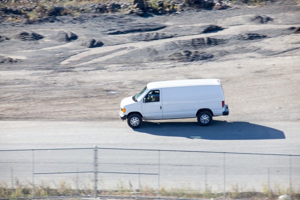 Panning test shot at 1/60 second at 600mm. I was tracking this moving van at 600mm while handholding the lens in OS mode 2, which detects and corrects for vertical or horizontal panning motion.