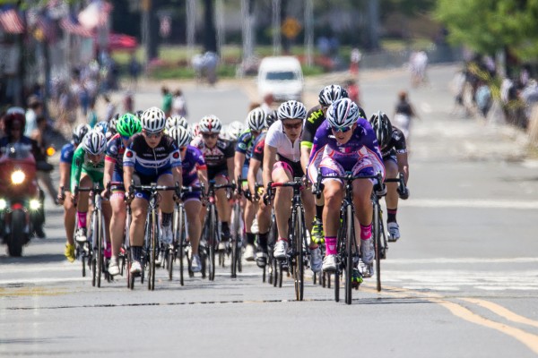 You can see the heat distortion in the background as the main pack of racers ride east on Main Street during the Tour of Somerville, as seen through the 150-600mm F5-6.3 DG OS HSM | Contemporary lens at 600mm. 1/2000 F6.3 ISO 400 on a Reb T3i.
