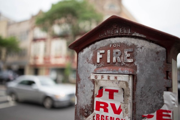 Close focusing at 35mm at F2 creates shallow depth of field. We fill much of the frame with the antique fire emergency box, focusing squarely on the raised lettering of the word FIRE. 1/1000 F2 ISO 100.