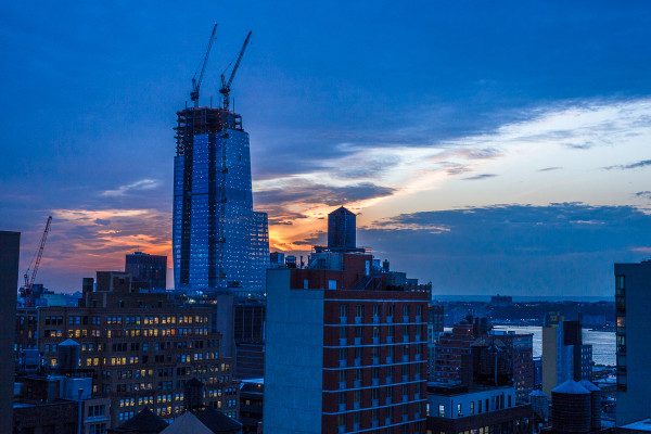 I wedged my camera and lens out the tiny opening of my hotel window to capture this view of the sunset over the Hudson River in twilight/blue hour. 1/1000 F3.5 ISO 800.