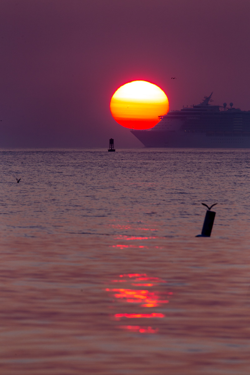 The sun rises over the Atlantic as a Cruise Ship heads for port. 1/50 F/10 ISO 100 at 600mm on a 6D. a llightweight Gitzo Traveller Carbon Fiber tripod worked for the pre-dawn segment of a photo hike.; but once the light got brighter, I was hand-holding the 150-600mm C for the next five hours and nine miles I walked that morning. 