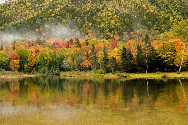 1.    On a placid lake in New Hampshire the fog from the neighboring mountain helped bring this photo to life.  1/50th of a second, f/ 3.5 ISO 100 @ 35mm. 