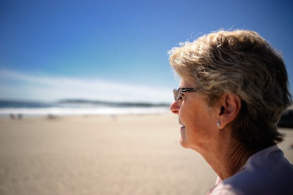 Here at the beach in Rhode Island, I photographed my wife looking out over the ocean.  The focus was on her glasses, wide open at f/2 hardly made it to her nose!  Shutter speed was 1/8000th of a second!