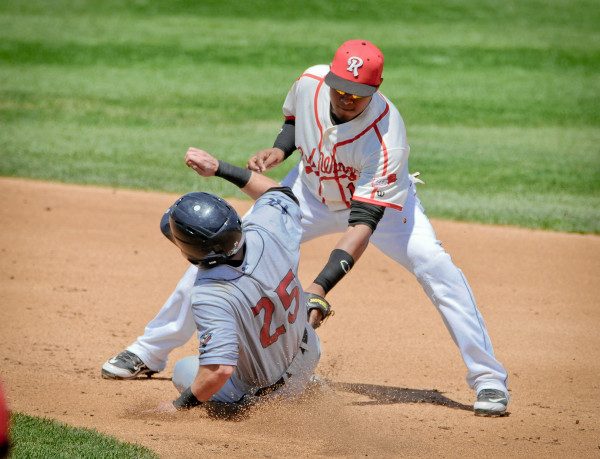 © 2015 Steve Chesler | Rochester Redwings Shortstop Argenis Diaz tags out Scranton/Wilkes-Barre RailRiders Pitcher Brady Lall at second base. The Sigma 150-600mm Sport lens quickly locked on focus at second base and then pressing the AF-L button on the D300 locked the focus to avoid having the focus jump to the back of the sliding runner.