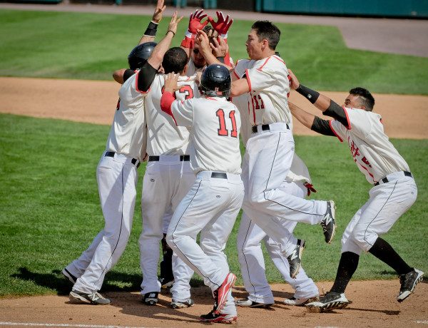 © 2015 Steve Chesler | The Red Wings celebrate a walk off double to win the game completing a perfect day at Frontier Field in Rochester, NY.