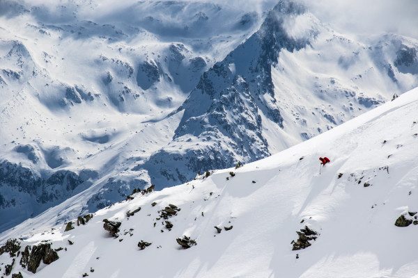 On this shot I wanted to pull in the majesty of the Alps so I had my skier on a far off slope and shot at 230mm. On my Canon 7DMKII this equates to 368mm on full frame. Skier John Trousdale. ISO 200 at 1/1600 sec. at f/10