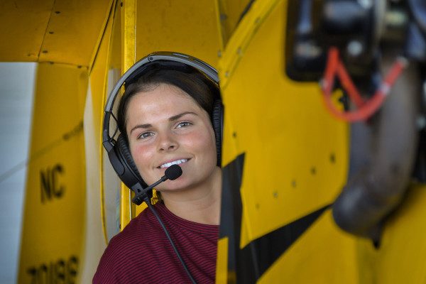 © 2016 Jim Koepnick | Zooming in to 175mm gives a nicer photograph of student pilot Jamie as well as removes a lot of distraction from the background. Sigma 18-300mm; Nikon D5; 1/125 sec at f6; ISO 400.